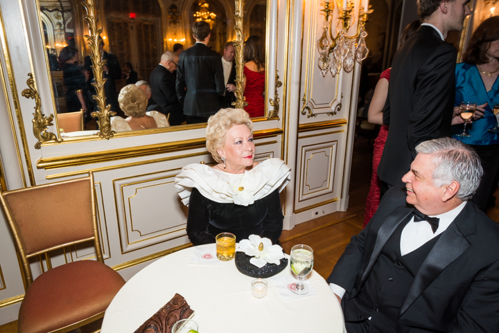  Richard Grondine chats with Maryelle Atkinson, whose dramatic collar and coordinating bag were elegant fashion favorites of the Russian Ball.&nbsp; 