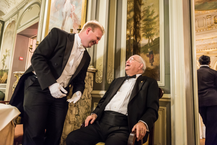  Ball Chairman Paul du Quenoy laughs with Count Vladimir Tolstoy at the Russian Ball on January 11. From his installment in a chair near the door, Tolstoy regaled passersby with witty remarks, stories, and cheers. 