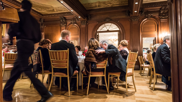  Partygoers seated at the head table conspire as waiters bring out the soup course at the Russian Ball. Black and white tie tuxes, fur, and sequins were de rigueur for the evening at the Cosmos Club. 